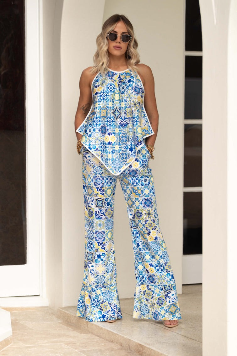 Stylish and comfortable Sorrento Wide Leg Trousers with ankle ties in an italian tile print azulejos design, these feature a wide leg, adjustable ankle and elasticated waist..Reversible top resort pants wide leg pants worn with a matching reversible top in the same italian tile print pattern  #colour_blue