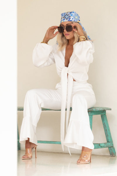 Elegant silk satin white trousers and matching tie top set, perfect for brides, bridal showers, and other bridal events.